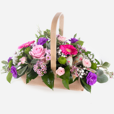 Bon Bon - Shower them with love with this cutesy collection of seasonal flowers in pretty pastels. Beautifully arranged and stylishly presented in a traditional basket. 
